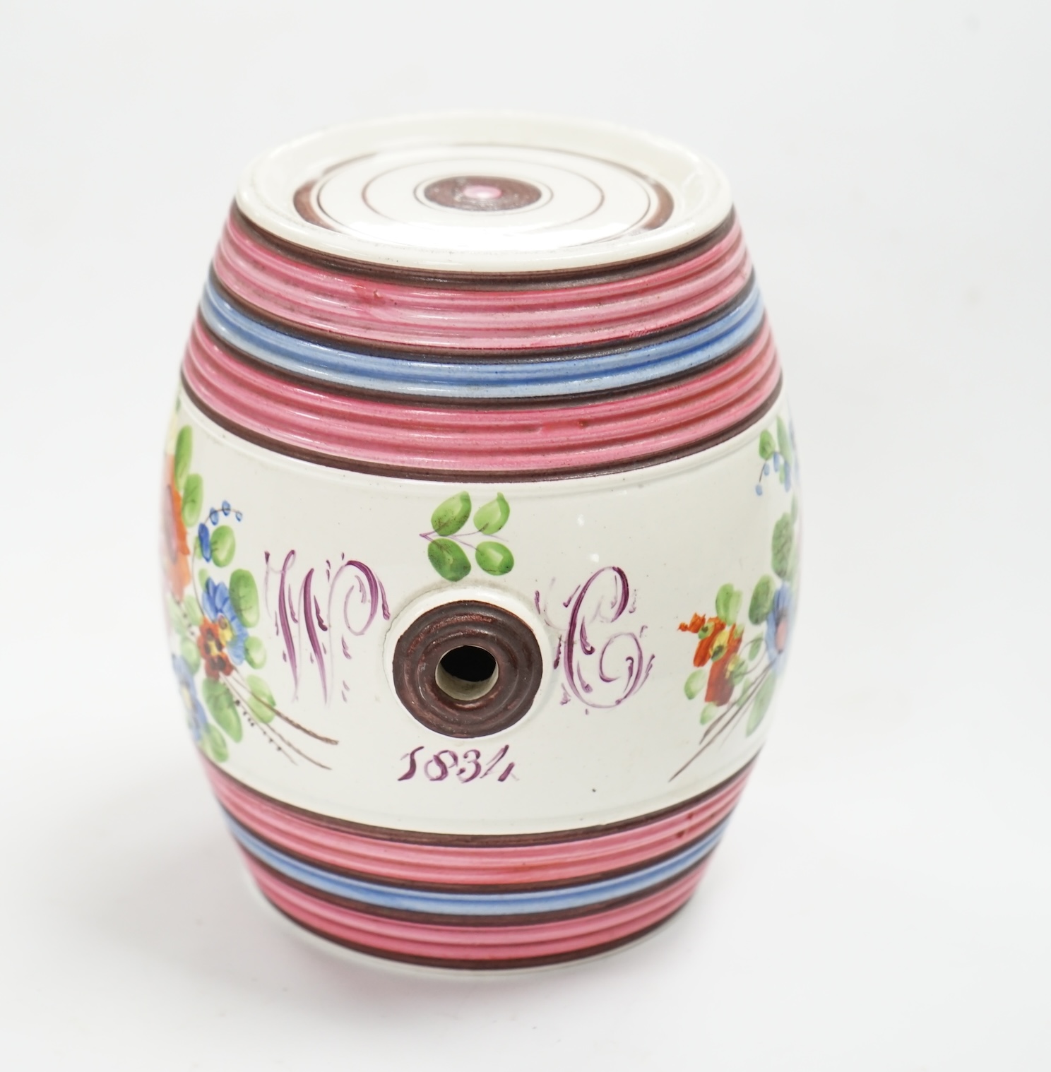 A small Victorian dated spirit barrel dated 1834, decorated with flowers and a monogram, 12cm high. Condition - good